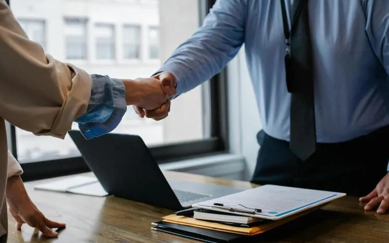 Shaking hands after a business agreement.