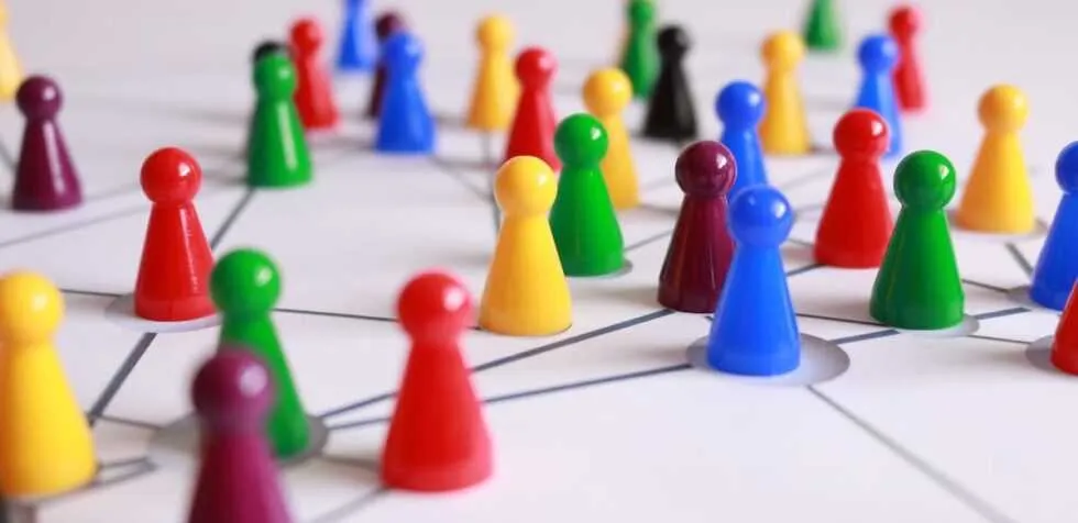 Game pieces symbolizing a compete and collaborate with each other strategy.